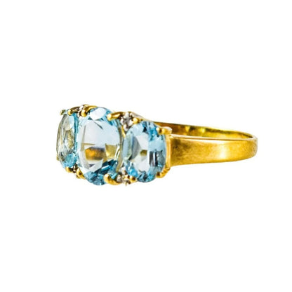 Vintage 9ct yellow gold blue topaz and diamond trilogy three stone cocktail ring, size P 1/2