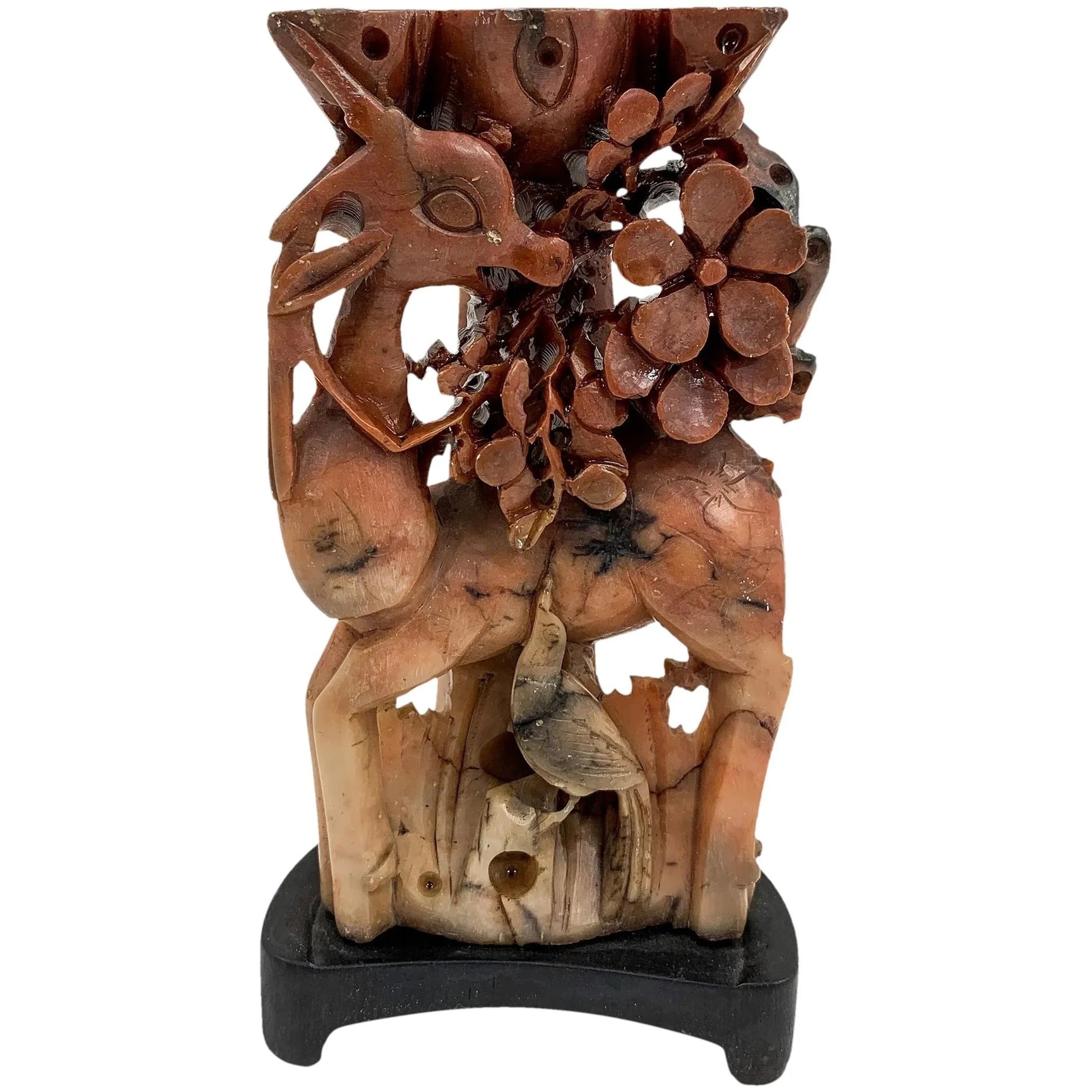 Qing dynasty red soapstone figural candlestick with deer, bird and prunus tree