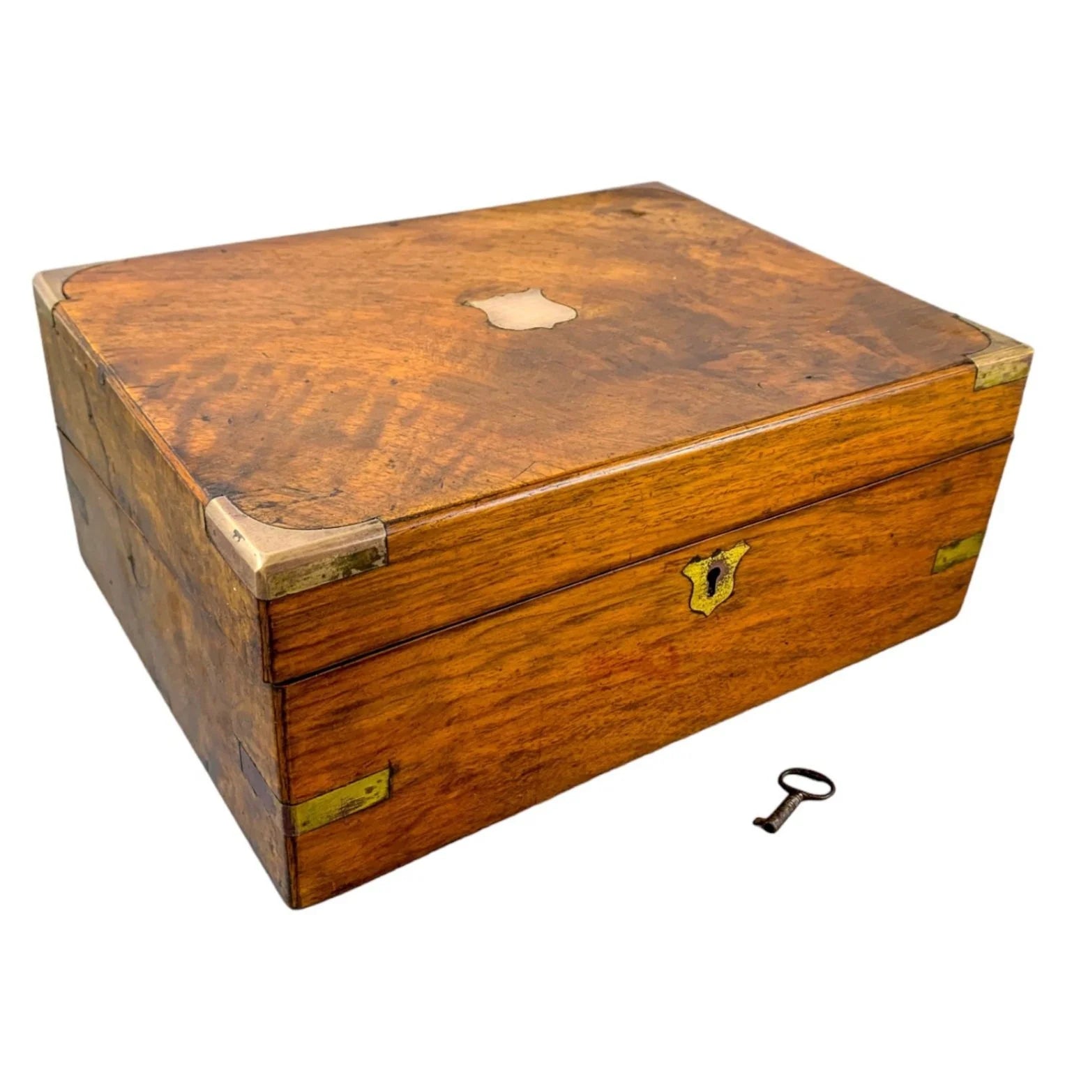 Victorian walnut military campaign writing slope with brass mounts and vacant shield, with key