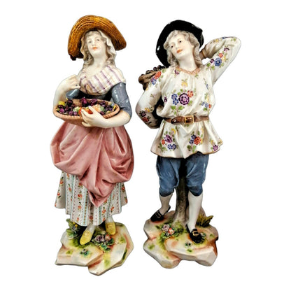 Pair of large Ludwigsburg porcelain figurines of peasant girl and boy with autumn harvest