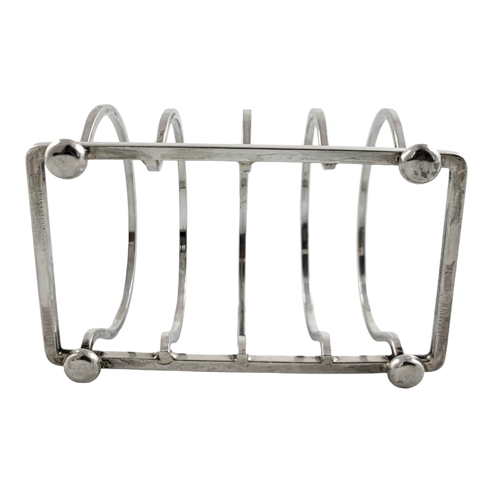 George V round sterling silver 4 slot 5 bar toast rack raised on bun feet, Walker & Hall
