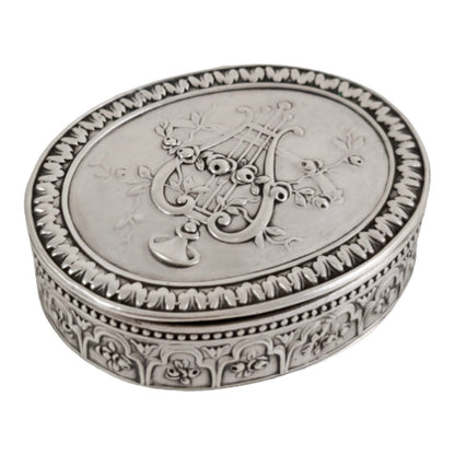 Antique Continental gilt solid silver oval snuff / pill box embossed with lyre and flower garlands