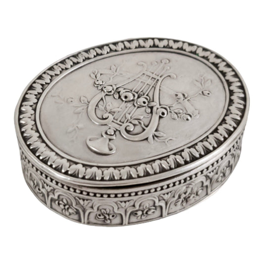 Antique Continental gilt solid silver oval snuff / pill box embossed with lyre and flower garlands