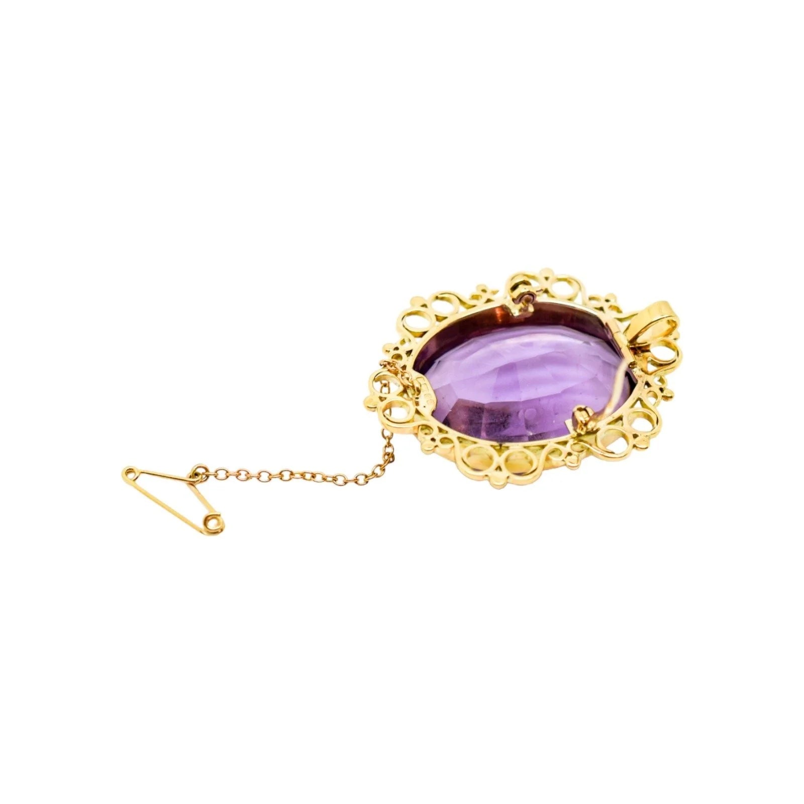 1980's huge 45 ct amethyst oval combination brooch and pendant in openwork 9ct gold setting