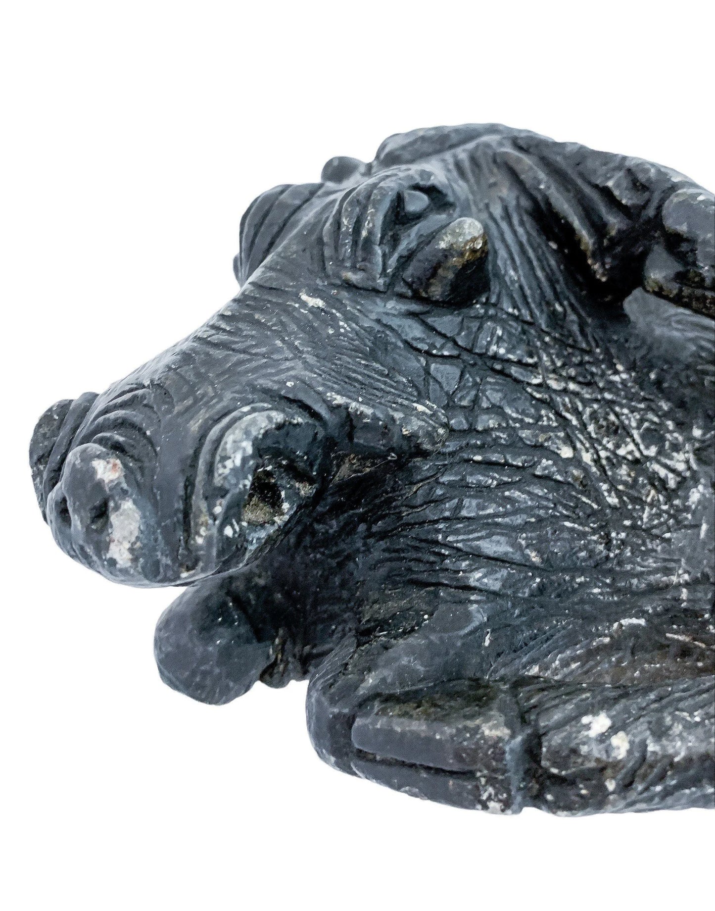 Folk art tribal African soapstone statue of a reclining warthog scratching its ear