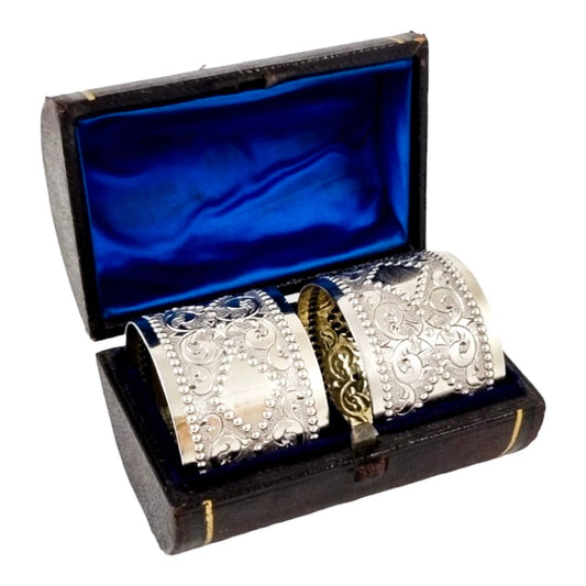Victorian sterling silver boxed pair 2 napkin rings scrolls & beads, vacant cartouche, William Hunter 1876