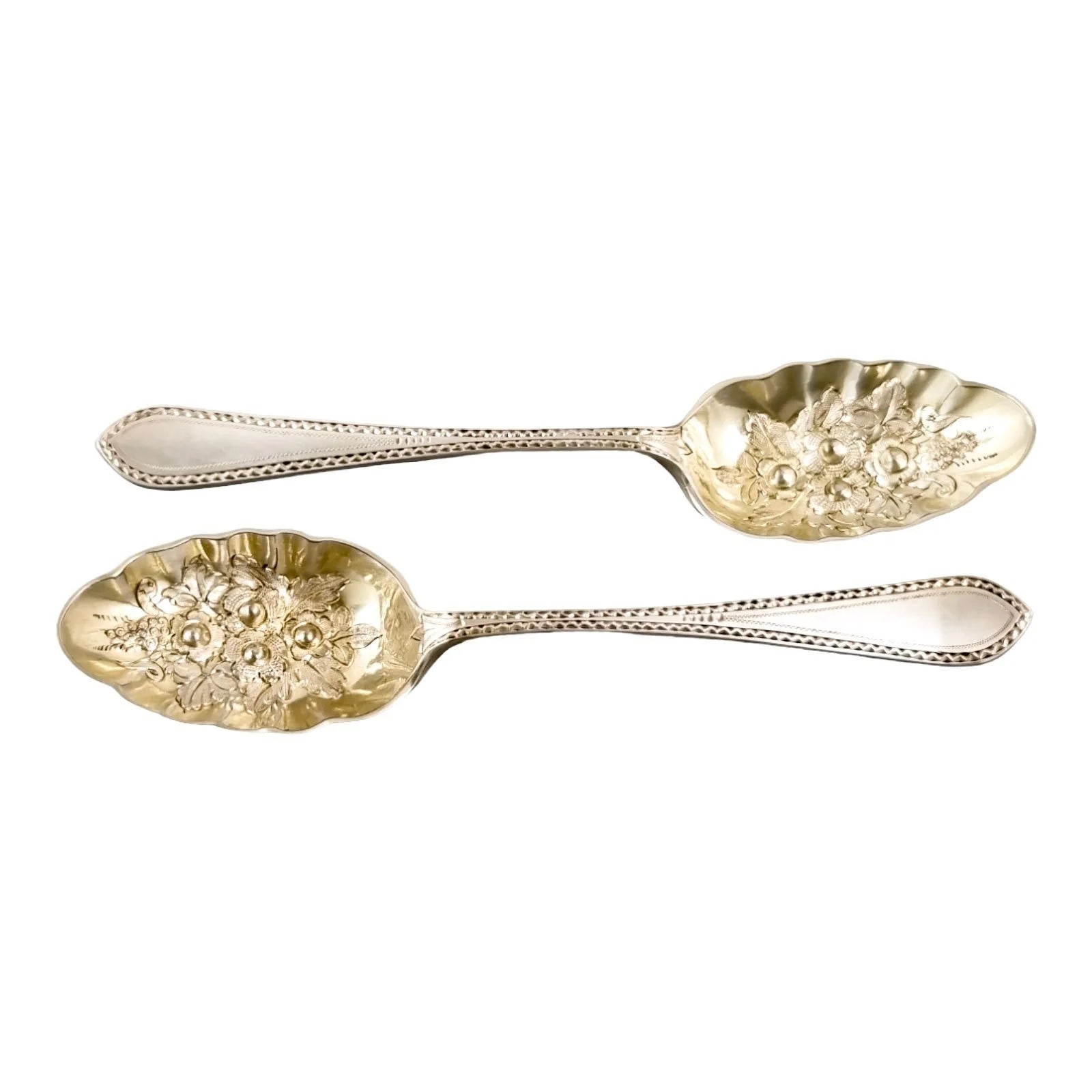Pair of Victorian gilt silver plated dessert berry spoons with frilled edges