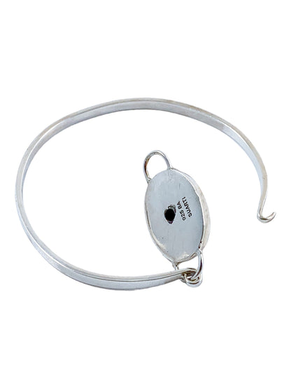 Suarti Bali sterling silver bangle bracelet with an oval medallion decorated with beaded scrolls