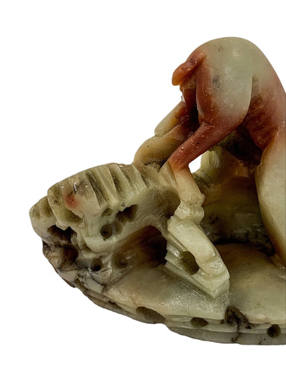 Chinese Republic red yellow soapstone figurine of small monkey on rocks