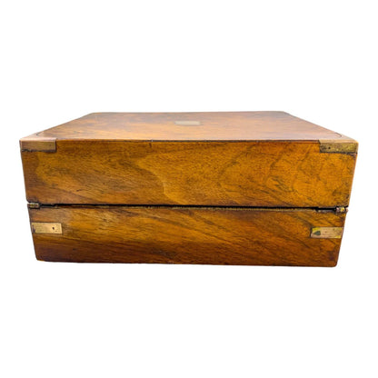 Victorian walnut military campaign writing slope with brass mounts and vacant shield, with key