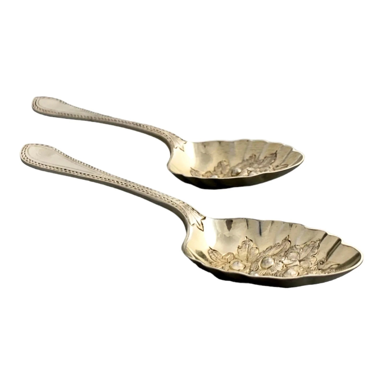 Pair of Victorian gilt silver plated dessert berry spoons with frilled edges