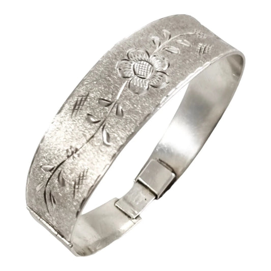 Vintage 70's sterling silver large bangle bracelet, bright-cut with flowers on brushed matte ground