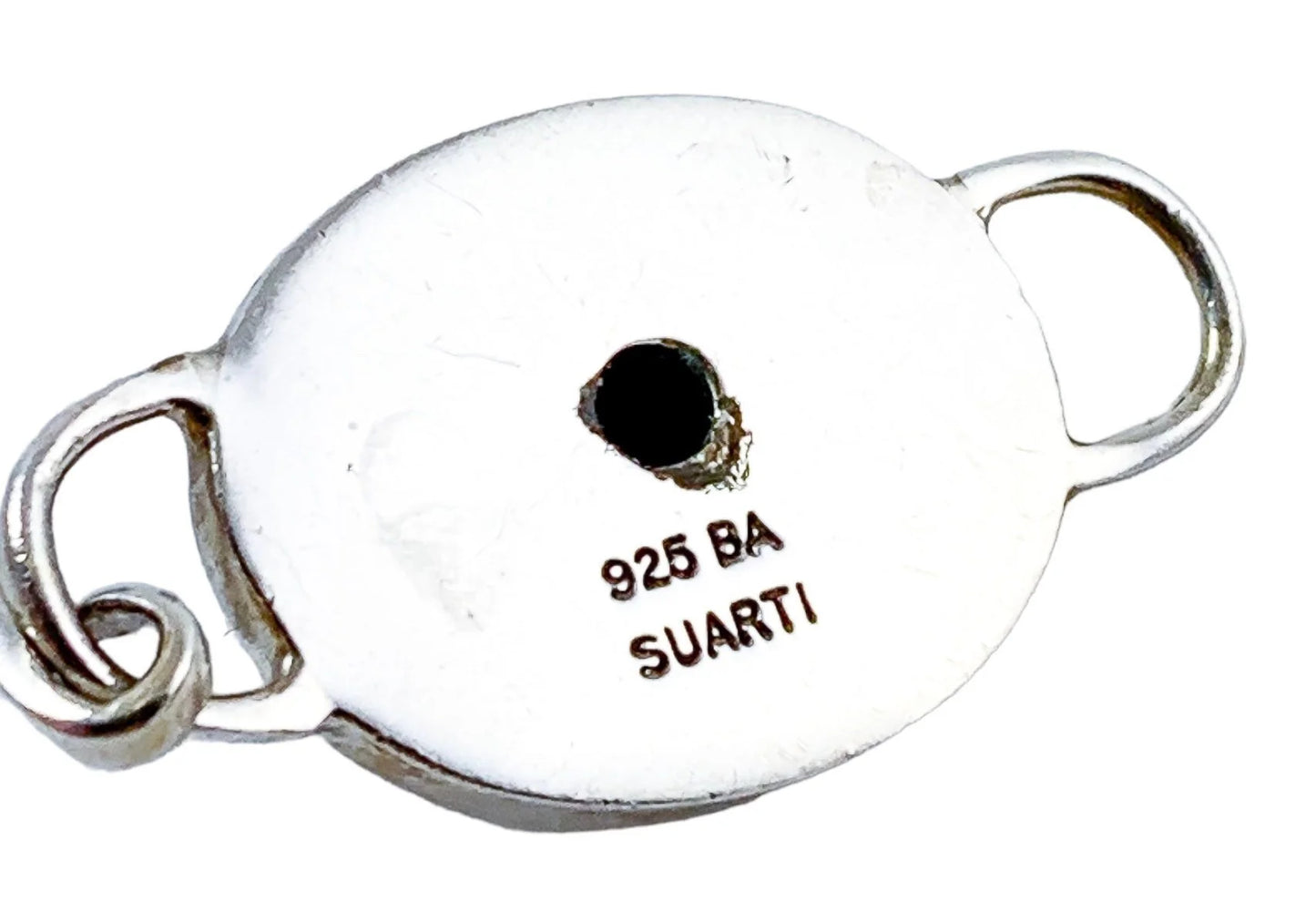 Suarti Bali sterling silver bangle bracelet with an oval medallion decorated with beaded scrolls