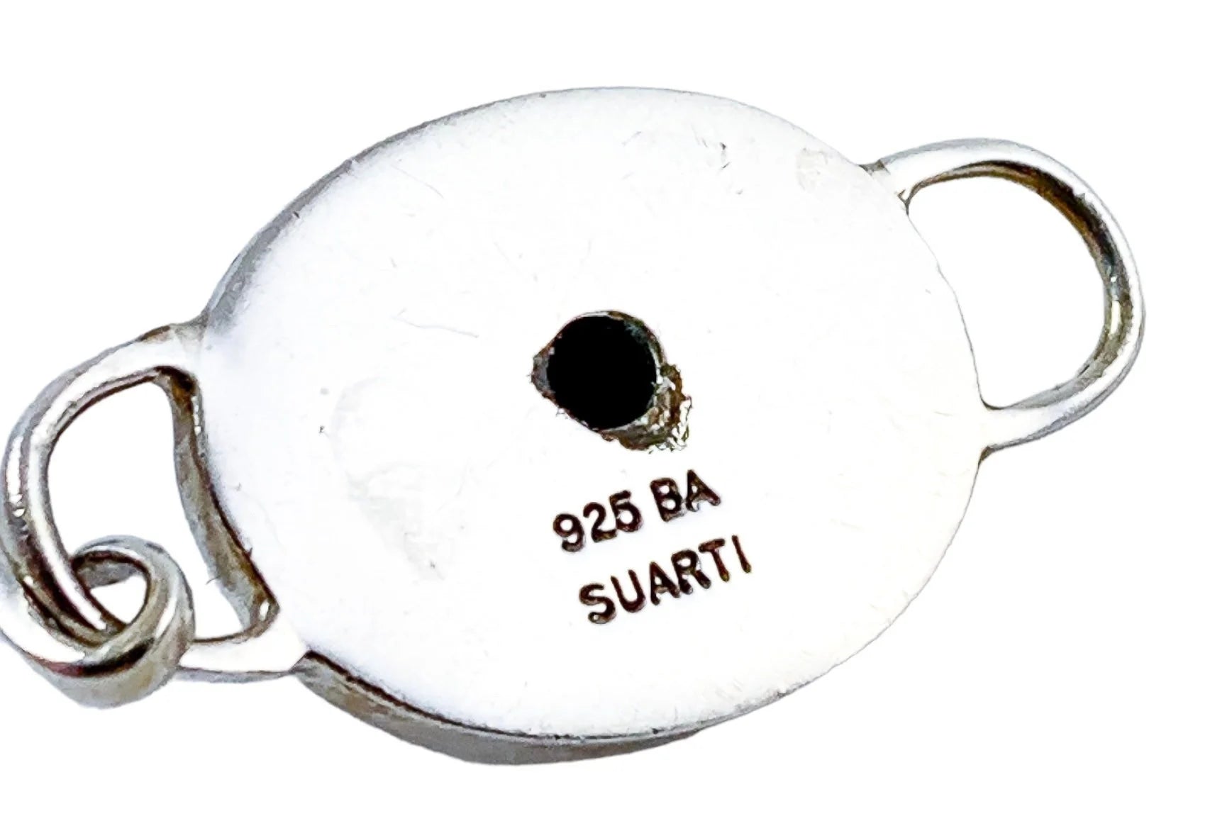 Suarti Bali sterling silver bangle bracelet with an oval medallion decorated with beaded scrolls