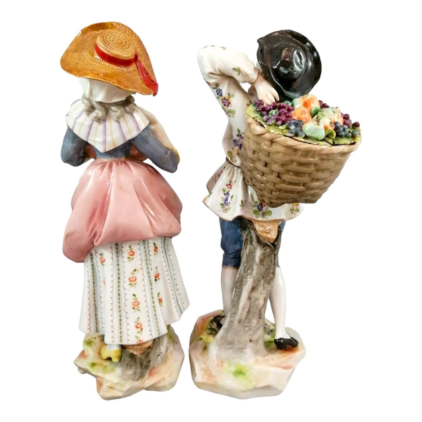 Pair of large Ludwigsburg porcelain figurines of peasant girl and boy with autumn harvest