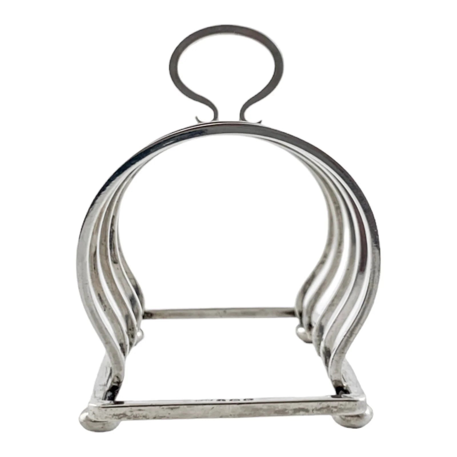 George V round sterling silver 4 slot 5 bar toast rack raised on bun feet, Walker & Hall