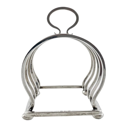 George V round sterling silver 4 slot 5 bar toast rack raised on bun feet, Walker & Hall