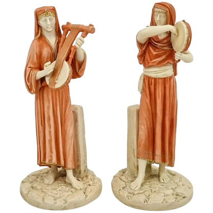 Pair of Victorian Royal Worcester (James Hadley) figurines of Egyptian musicians, model 1084