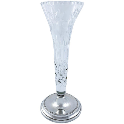 Tall crystal trumpet vase resting on a sterling silver stepped round foot