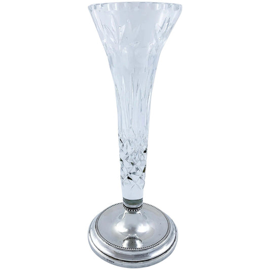 Tall crystal trumpet vase resting on a sterling silver stepped round foot