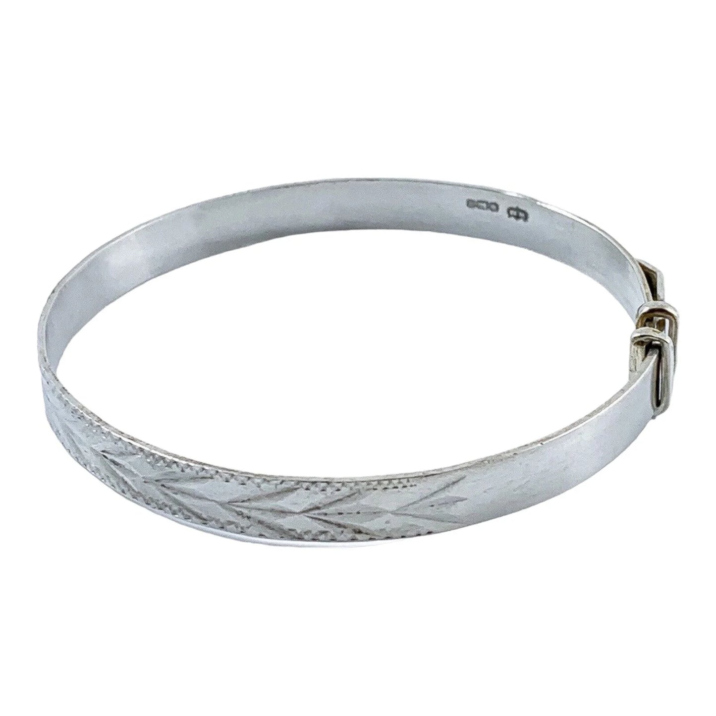 1970’s sterling silver child's adjustable "belt" bracelet with buckle detail and bright-cut leaf design