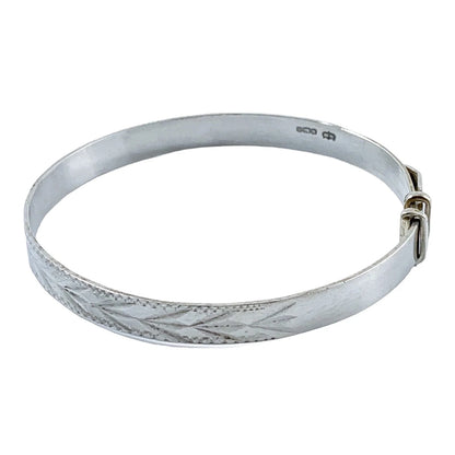 1970’s sterling silver child's adjustable "belt" bracelet with buckle detail and bright-cut leaf design