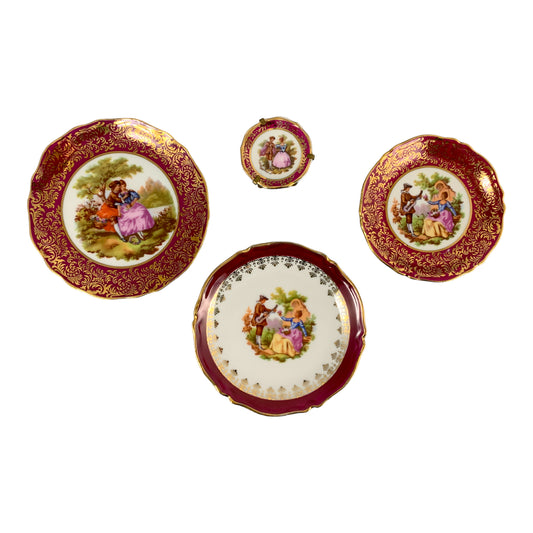 Vintage Meissner Limoges graduated set of 4 miniature fluted plates; courting couples in red and gilt
