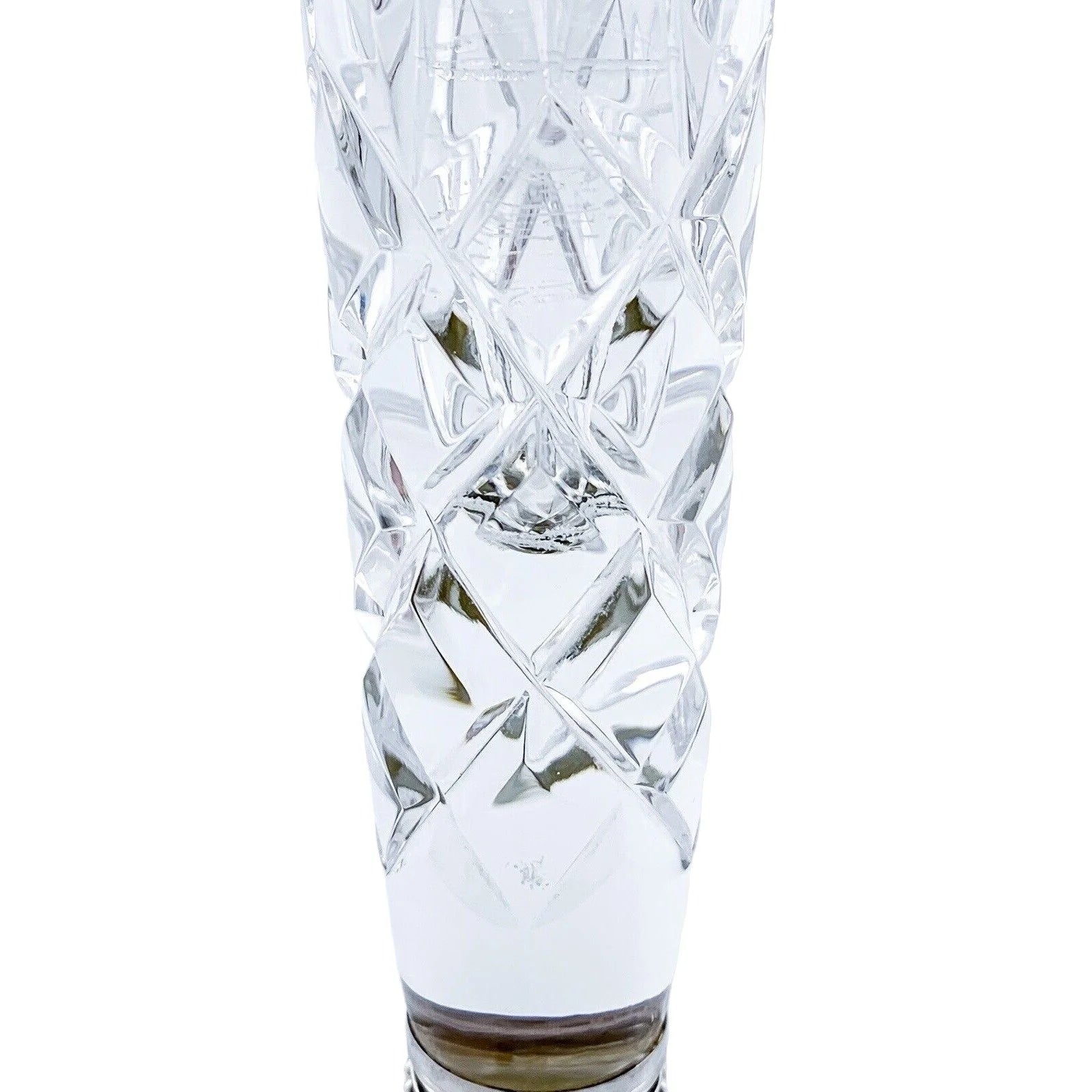 Tall crystal trumpet vase resting on a sterling silver stepped round foot