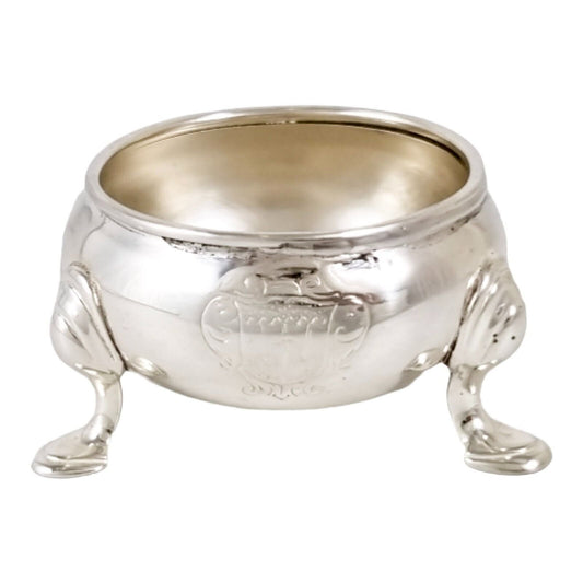 George II sterling silver large tripod salt cauldron on hoof feet, armorial family crest, 1735