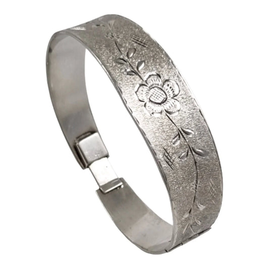 Vintage 70's sterling silver large bangle bracelet, bright-cut with flowers on brushed matte ground